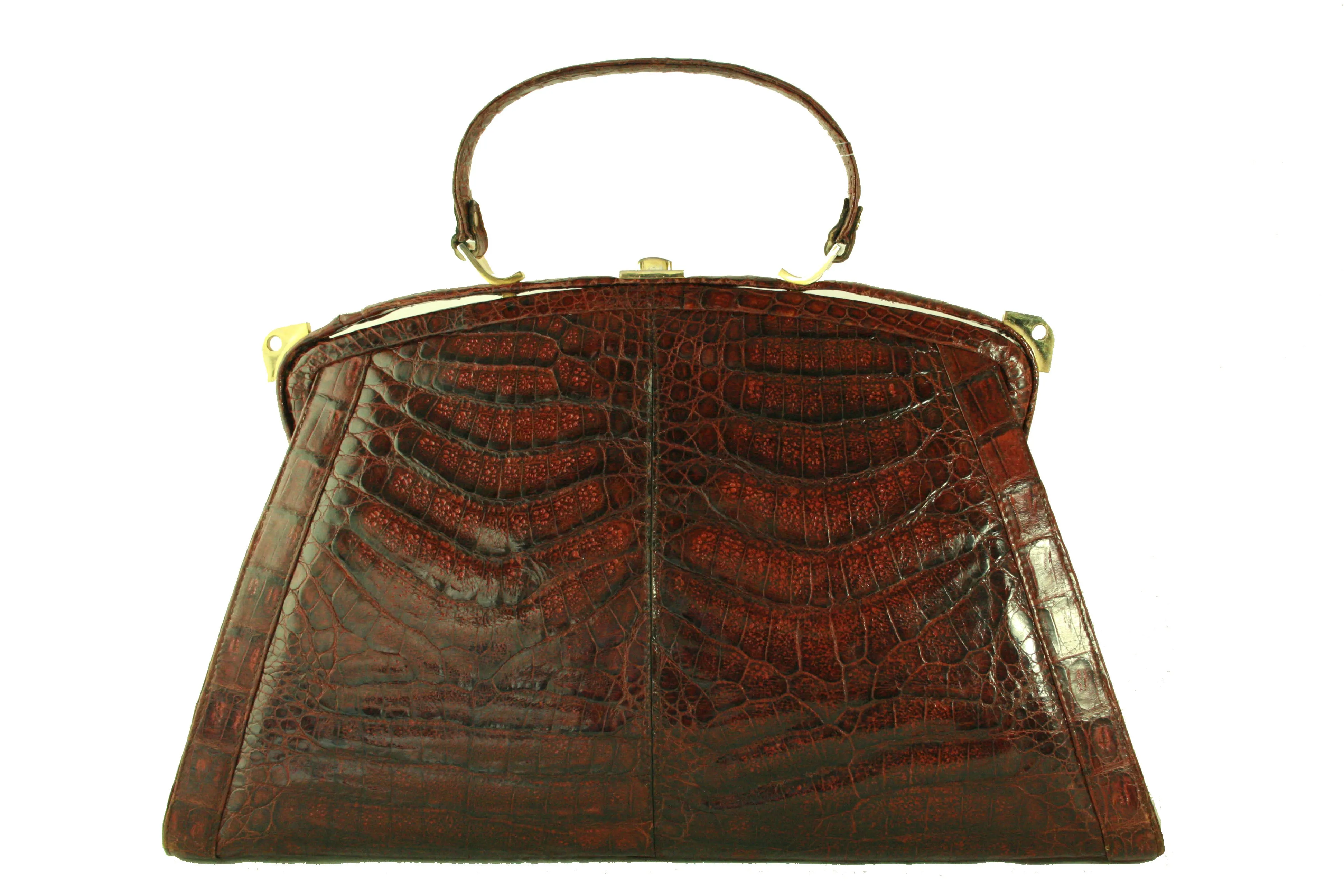 Sizable reddish-brown crocodile skin handbag