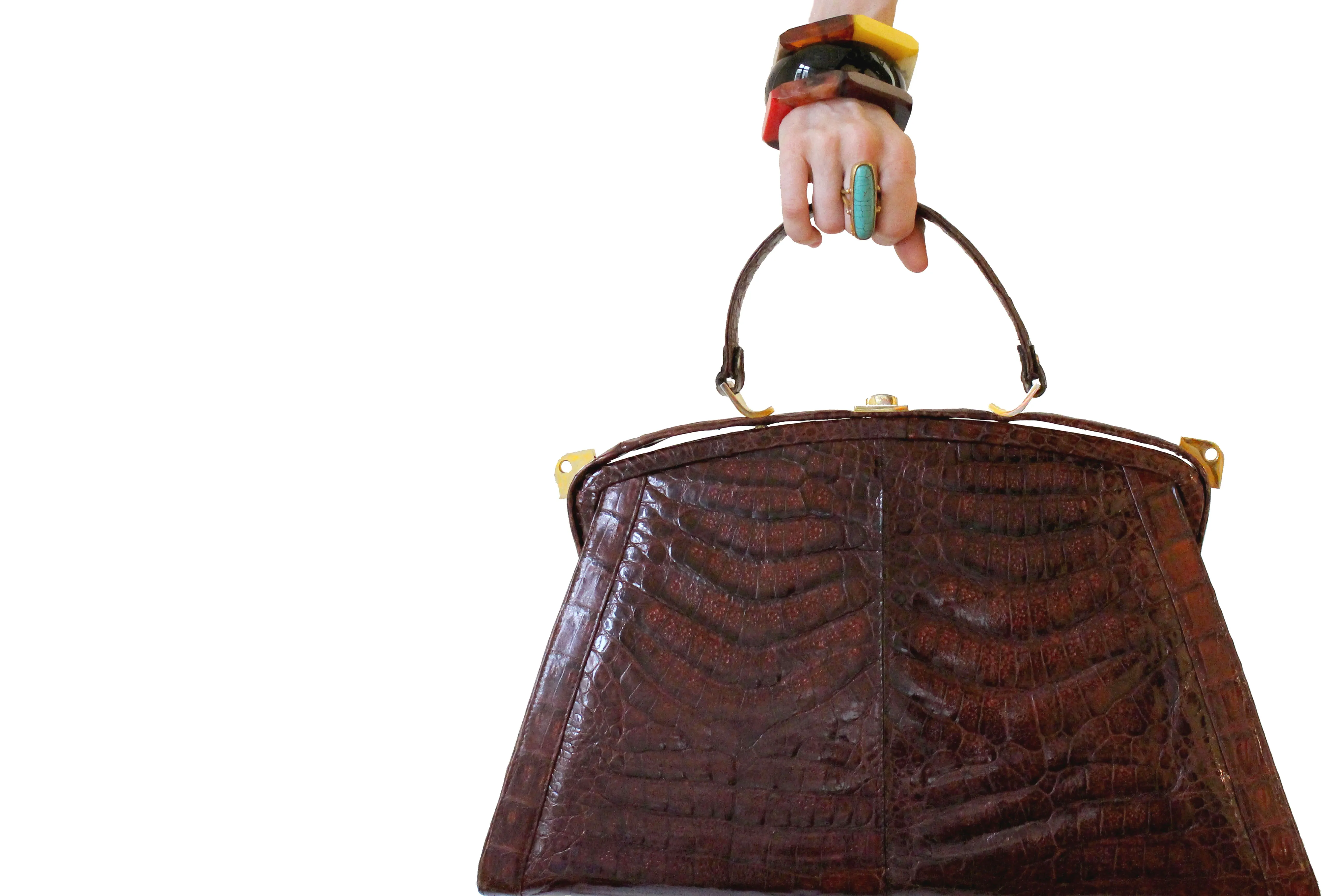 Sizable reddish-brown crocodile skin handbag