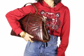 Sizable reddish-brown crocodile skin handbag